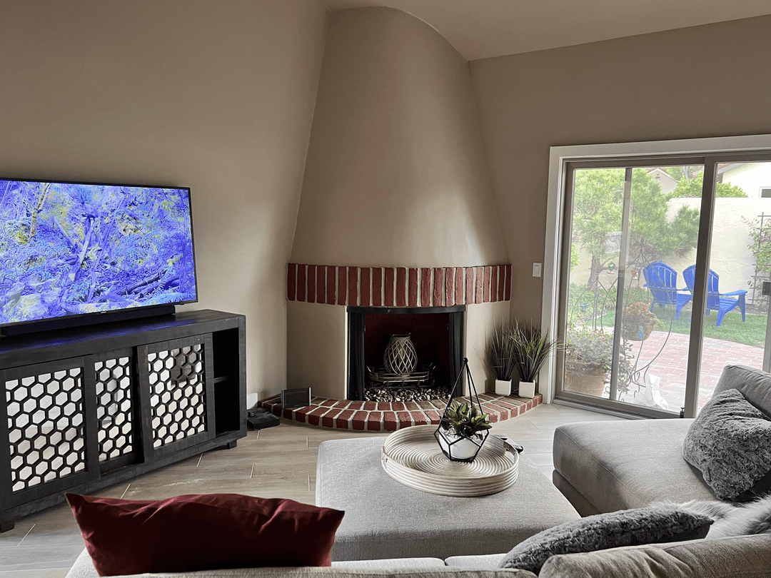 Living room with fireplace after professional interior painting