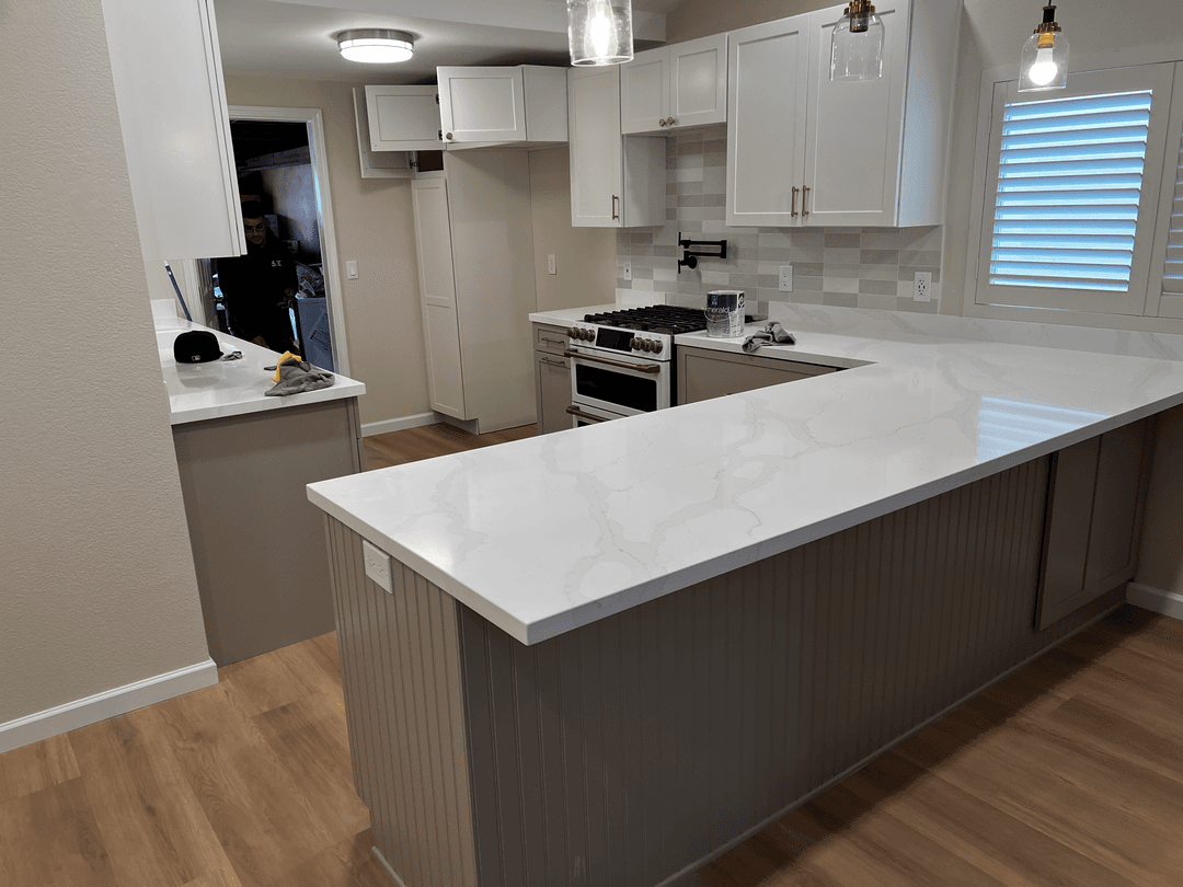 Kitchen remodel with freshly painted cabinets and walls