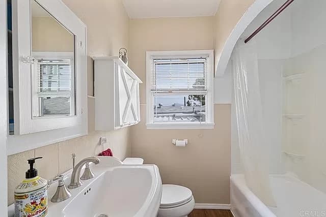 Bathroom interior painting with tub, vanity, and natural lighting